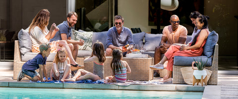 Friends sitting outside on a patio set