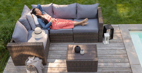 Lady sitting on a patio set outside