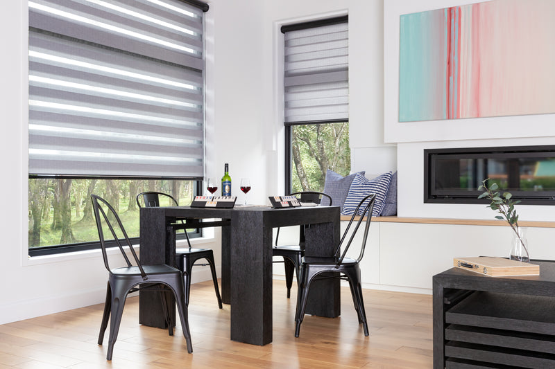 A bright small kitchen and living room in a small apartment.