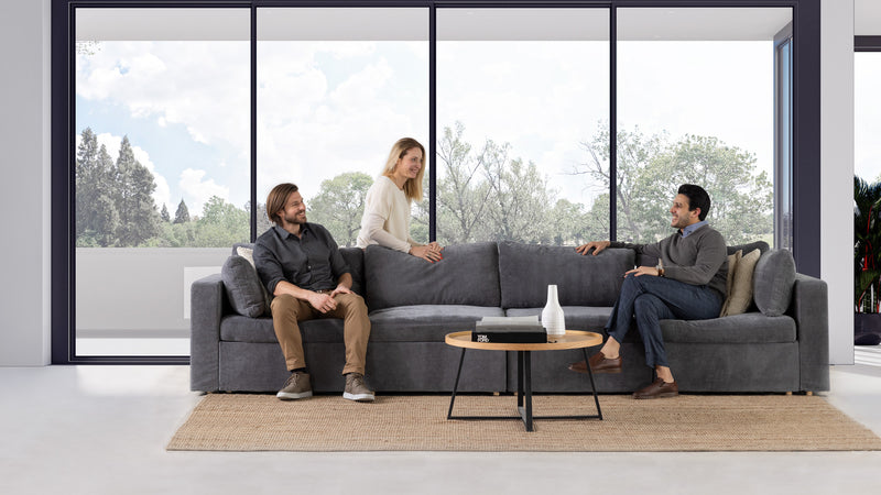 3 persons sitting on sofa