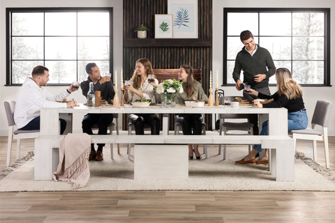 A family sitting at a dining table set