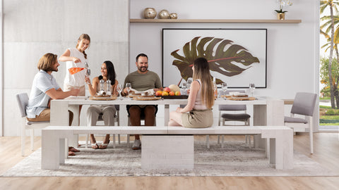 A family sitting at a dining table